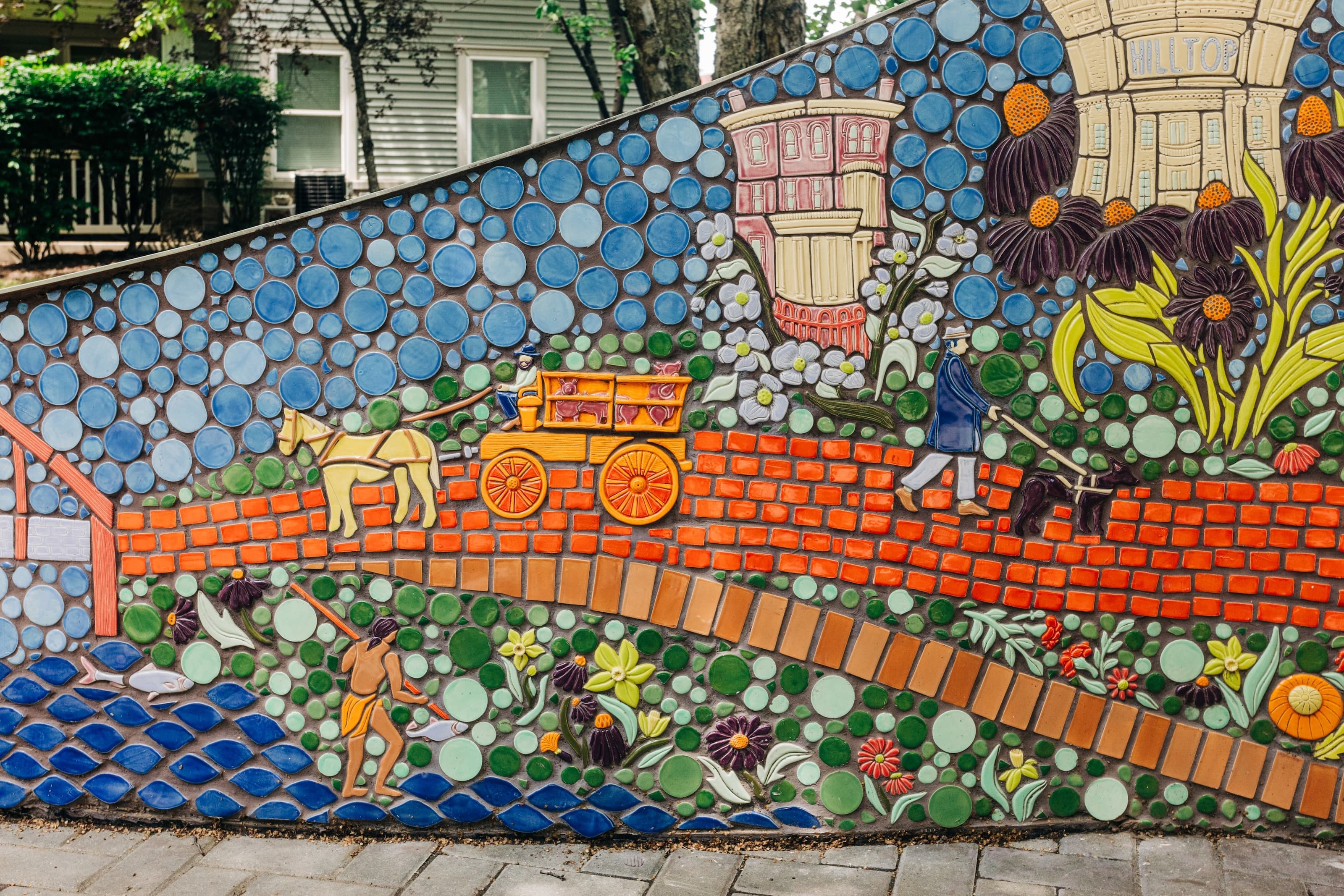 Segment of the art experience featuring a carriage, a dogwalker and a fisherman